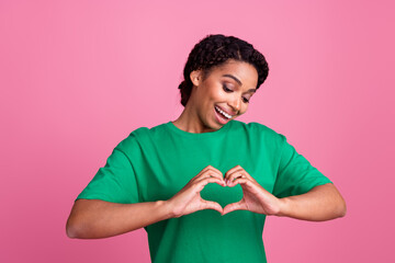 Photo portrait of lovely young lady look show heart symbol dressed stylish green garment isolated...