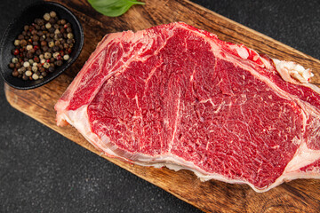 Raw beef steak meat fresh tasty food dish delicious gourmet food background on the table rustic food top view copy space keto and paleo diet