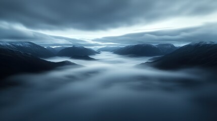 A misty mountain range with a cloudy sky