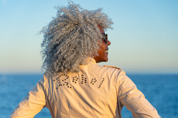 Grey haired afro-american woman in back-view