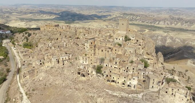 Aerial view of Craco, a ghost town in the province of Matera, Basilicata, Italy. The historic center was depopulated due to a landslide and has become a tourist destination.