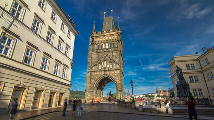 Naklejka premium Old Town Bridge Tower of the Charles Bridge timelapse hyperlapse - one of the most beautiful Gothic constructions in world.