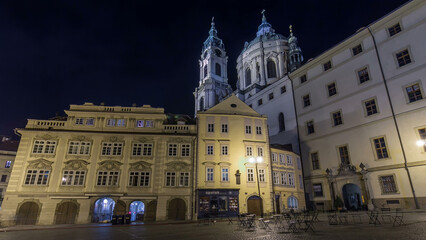 Obraz premium Night view of the illuminated malostranske namesti square timelapse hyperlapse in prague