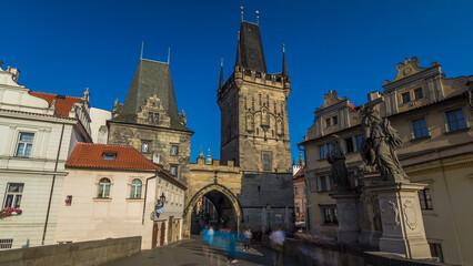A view along Charles Bridge in Prague towards the Lesser Quarter in the morning timelapse hyperlapse.