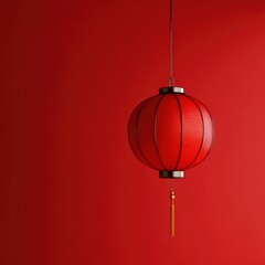 Fototapeta premium a red lantern hanging from a ceiling
