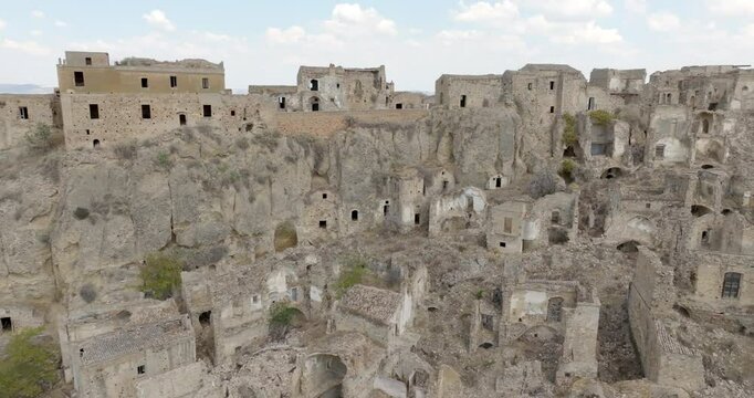 Skyline of Craco, a ghost town in the province of Matera, Basilicata, Italy. The historic center was depopulated due to a landslide and has become a tourist destination.