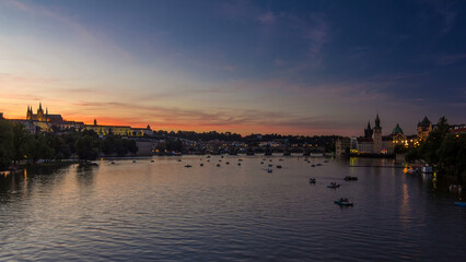 View of the city Prague in Czech Republic day to night timelapse on the Vltava river with beautiful sky