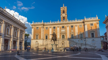 Obraz premium Capitoline hill landmark square timelapse hyperlapse surrounded by neo classic museums buildings with clock tower and bronze statue of Mark Aurelius