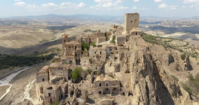 Aerial view on the historic center of Craco, a ghost town in province of Matera, Basilicata, Italy. The historic center was depopulated due to a landslide and has become a tourist destination.