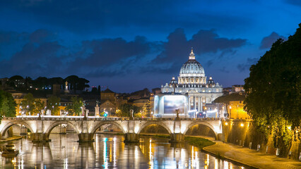 Fototapeta premium St. Peter's Basilica, Saint Angelo Bridge and Tiber River after the sunset day to night timelapse
