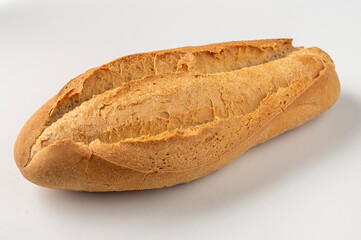 Typical Italian medium bread with of wheat flour and crispy crust isolated on white background