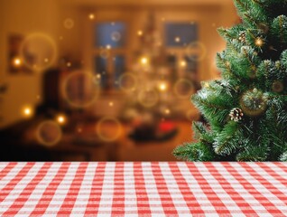 empty christmas table top with christmas tree in room