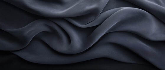 Fototapeta premium Close-up of a dark blue fabric with a smooth and elegant texture. the fabric appears to be made of a silky or satin-like material, with a subtle sheen that catches the light.