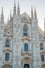 Fototapeta premium Close up of Milan Cathedral on Cathedral square in the morning, Milan, Lombardia, Italy. Detailed shot of Duomo di Milano with intricate Gothic architecture. Vertical orientation
