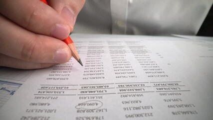 Accountant analyzing business marketing data on paper dashboard at office table. Corporate finance and money accounting concept.
