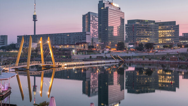 Donaustadt Danube City night to day timelapse is a modern quarter with skyscrapers and business centres in Vienna, Austria.