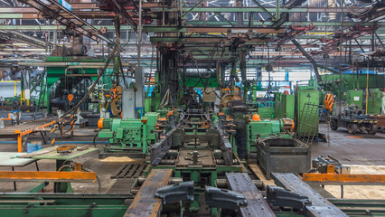 Conveyor assembly stage the body of tractor at big industrial factory timelapse