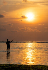 Fototapeta premium silhouette of a fisherman