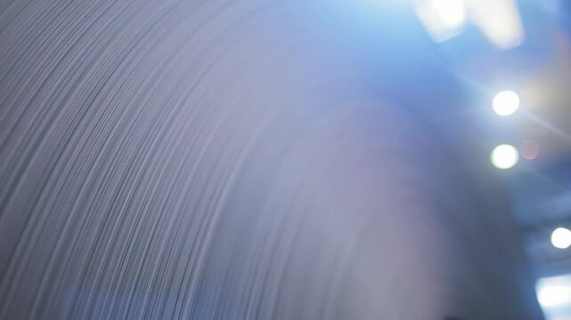 Close-up of a sheet aluminum rolls in the factory warehouse. Paper in the reel.