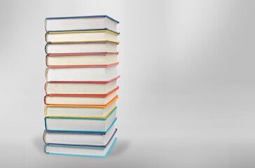 stack of old reading books on background