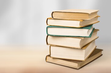 stack of old reading books on background