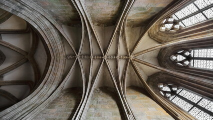 Arched ribs of the ribbed vault ceiling of a side chapel protruding southward from the ambulatory,...