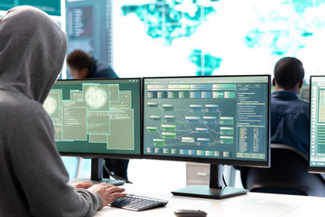 Governmental hackers team performing a cyber attack on database servers to gather intelligence...