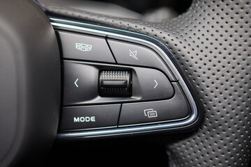 The modern cars steering wheel control panel boosts convenience and performance