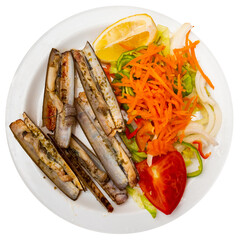 Seafood appetizer. Plate of baked razor clams served with fresh vegetable salad of shredded carrots, onions, tomato and lemon wedge for garnish. Isolated over white background