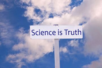Science is Truth Sign against a cloudy sky. The relevance of science is a current topic.