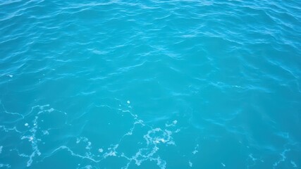 Fototapeta premium Close-up of pure blue turquoise water with foam and waves in the ocean, ocean, aqua, beauty