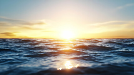 Obraz premium Vibrant sunset over a calm ocean, sun reflecting on water surface.