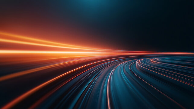 Abstract light trails create dynamic sense of motion and speed, showcasing vibrant colors of orange and blue against dark background, evoking energy and excitement.
