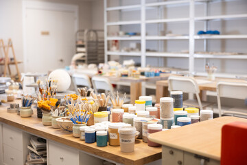 Machine clay press roller is ready for operation in pottery workshop. Mechanism for spreading raw clay, processing source material, close up