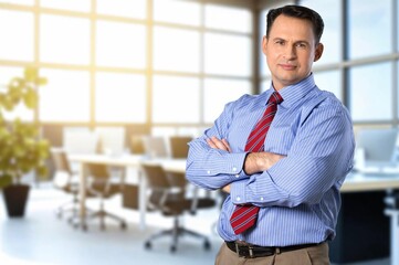 Happy business man looking at camera posing