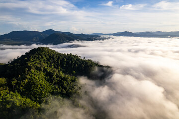 Amazing Sunrise or sunset over mountains hills covered with mist, Aerial view landscape drone shot beautiful colorful nature background