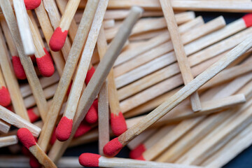 Cluttered and disorganized set of red-headed phosphor sticks