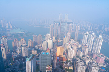  View from the rooftop of tall buildings in the city and beautiful cityscape with skyscrapers in Yangjiaping Chongqing China
