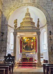 Korcula, Croatia - June 30, 2024: Saint Mark Cathedral. Main altar and chancel with large painting...