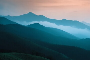 Fototapeta premium A mountain range with a blue sky in the background
