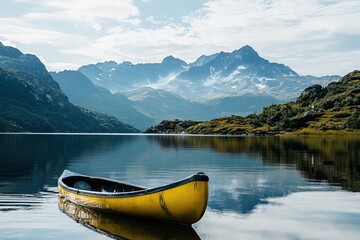 Obraz premium Yellow Canoe Awaits On Serene Mountain Lake