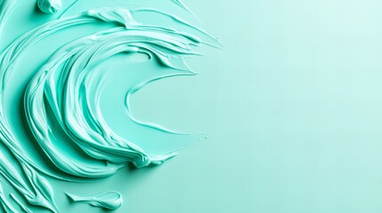 Abstract art featuring swirling strokes of light teal paint against a pale aqua background. The vibrant colors and dynamic movement create a visually captivating image.
