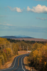 Rt 30 South heading towards Tupper Lake NY on a fall afternoon surrounded by fall foliage