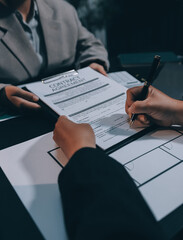 Close up Business people or Real Estate agent explain signing agreement for sale house to client. Property, Insurance, Broker concept.
