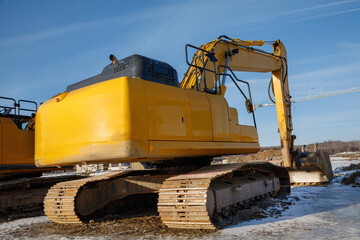 Rear View of Tracked Excavator on Construction Site