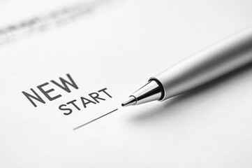 New Start Concept with Pen on White Background. Ideal for themes of motivation, success, and planning.