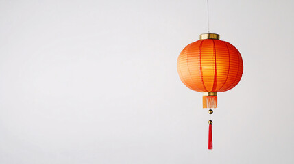 Obraz premium red chinese paper lantern hanging against white wall minimalist background