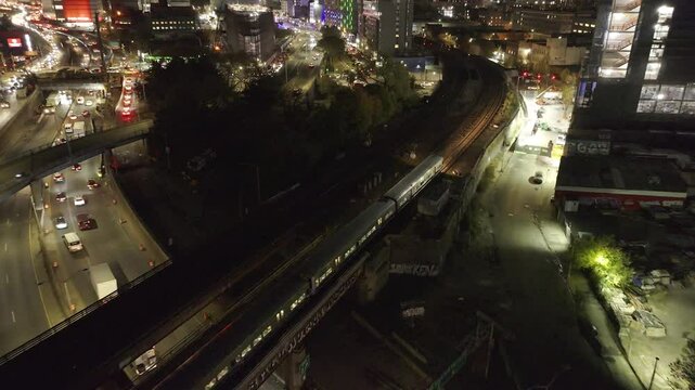 Aerial view of the Metro North Railroad in New York City. Shot at night in 4k.