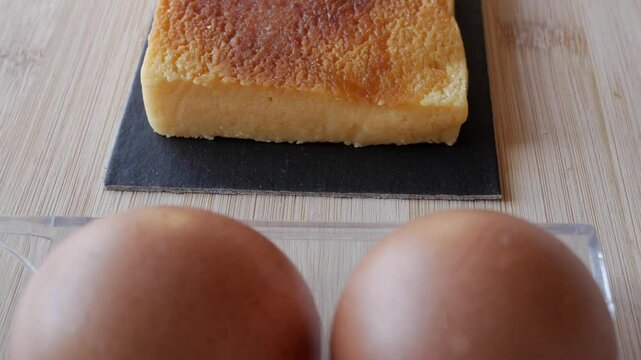 Turron Yema dessert with eggs on a wooden board, inviting and traditional