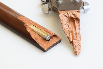 part of broken wood acoustic guitar isolated on white background